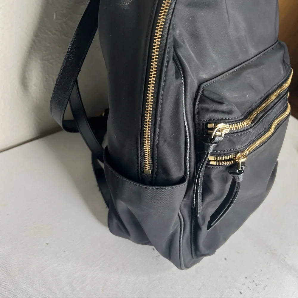 Kate Spade black gold zippers back pack